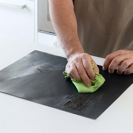 Non Stick BBQ Grill Mat trimmed to fit a grill