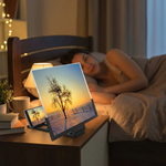 ScreenBoost 14-inch phone screen amplifier on a bedside table in use