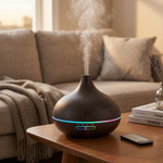 Aroma Bliss USB diffuser with LED lights running on a living room side table