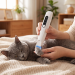 Cordless dog and cat hair trimmer with LED light grooming a calm cat
