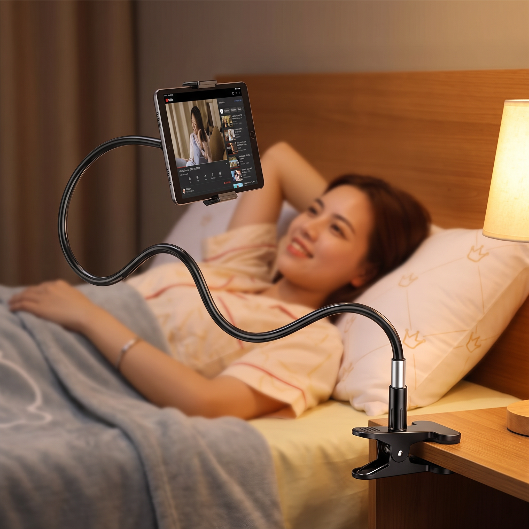 Adjustable tablet holder stand mounted at a bedside