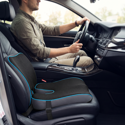 Memory foam car wedge seat cushion with straps supporting a driver's posture