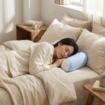 Cervical pillow in use on a bed