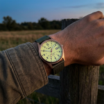 Military quartz watch with nylon strap worn outdoors