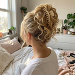 Clip-in curly hair bun worn as an updo